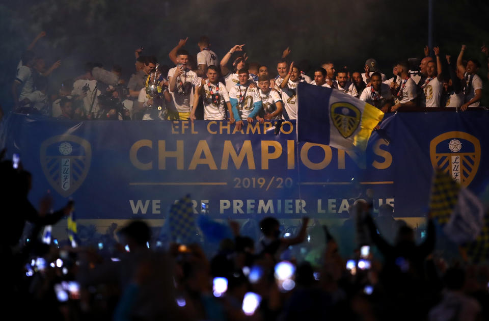 Leeds United celebrate with the Sky Bet Championship trophy on a bus outside the ground in front of fans after the match at Elland Road.