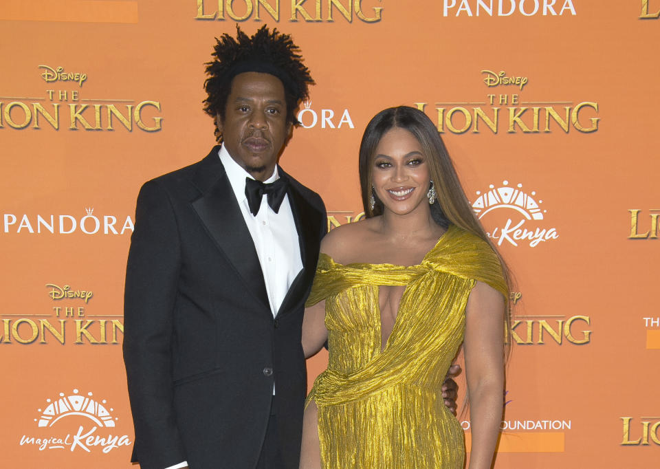 FILE - Singers Jay-Z, left, and Beyonce pose for photographers upon arrival at the "Lion King" premiere in London on July 14, 2019. Beyonce received nine Grammy nominations Tuesday, making her tied – with her husband Jay-Z – as the most nominated music act in the history of the awards show. The 2023 Grammy Awards will air live Sunday, Feb. 5. (Photo by Joel C Ryan/Invision/AP, File)