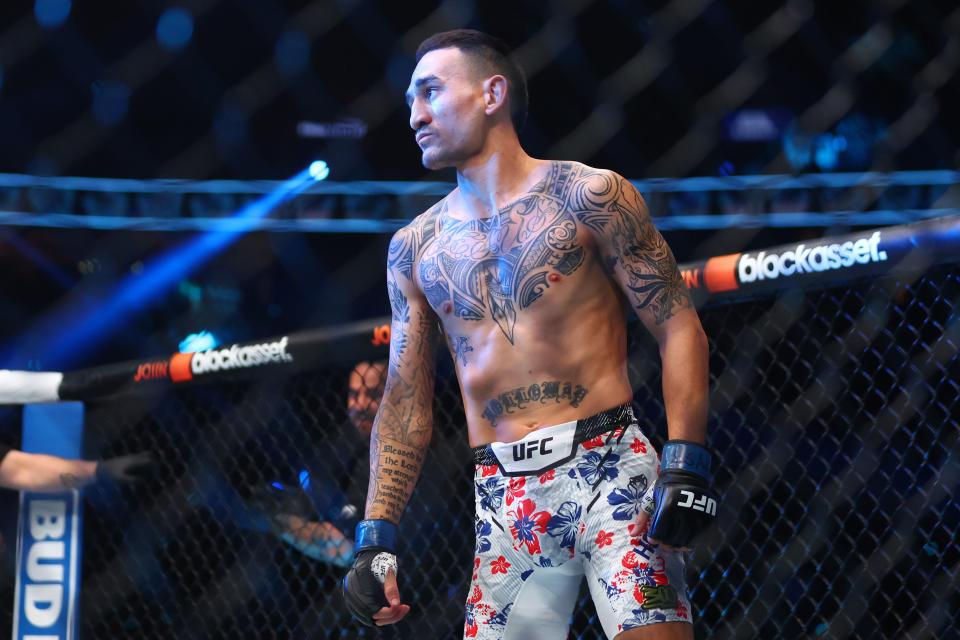 Apr 13, 2024; Las Vegas, Nevada, USA; Max Holloway (blue gloves) reacts after defeating Justin Gaethje (not pictured) during UFC 300 at T-Mobile Arena. Mandatory Credit: Mark J. Rebilas-USA TODAY Sports