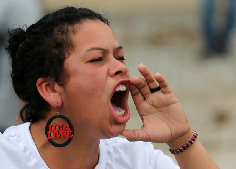 Supporter of Brazil's former president Luiz Inacio Lula da Silva reacts outside the Federal Police headquarters where Lula is serving a prison sentence, in Curitiba