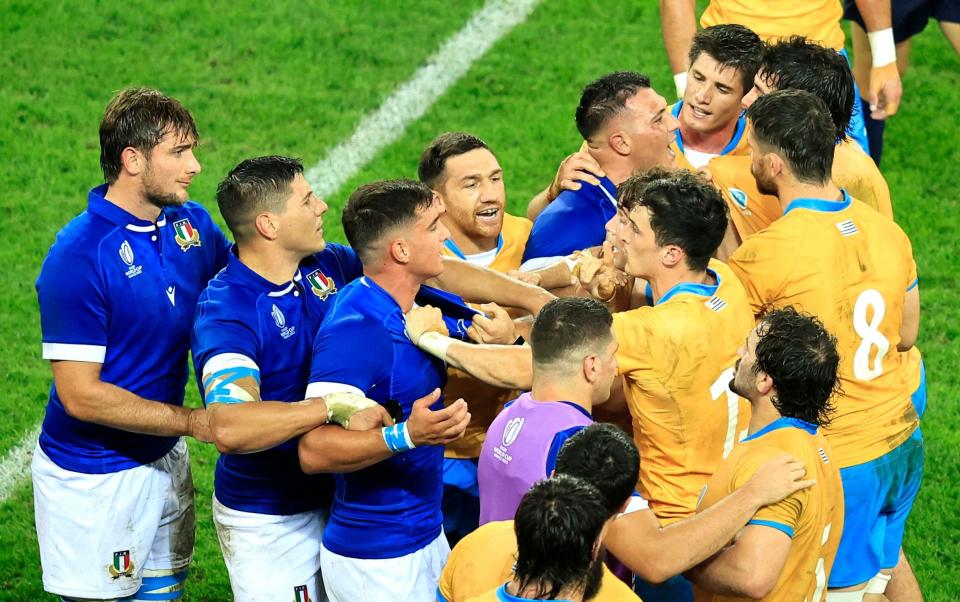 Italy and Uruguay players argue at the end of the match