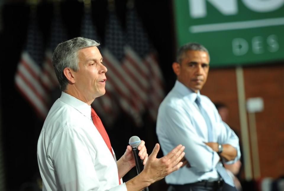 U.S. Secretary of Education Arne Duncan speaks alongside U.S. President Barack Obama at a town hall style meeting at North High School on September 14, 2015 in Des Moines, Iowa. (Photo by Steve Pope/Getty Images)