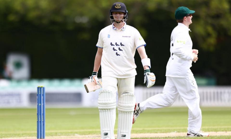 Steve Smith of Sussex and Australia leaves the field after being dismissed lbw by Josh Tongue.