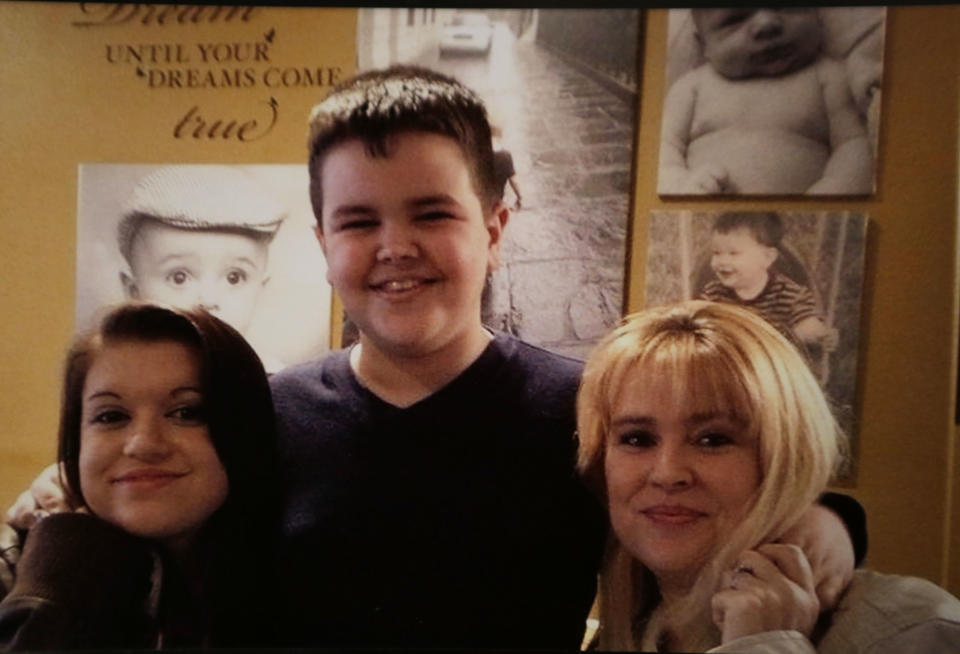 This undated family photo provided by Kainan and Jessica McAllister, shows Denise Freeman, right,with her children Kacie and Joshua. Denise was the first victim in the killing spree at the hands of her husband, Benjamin Freeman. The shootings stunned the bayou community 50 miles southwest of New Orleans. Investigators, victims and grieving family members don’t know exactly what set off Freeman’s rampage. But the shootings raised concerns about whether Louisiana law provides adequate safeguards to keep guns away from troubled people. (AP Photo/Gerald Herbert)
