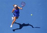 Angelique Kerber of Germany hits a return to Alison Riske of the U.S. during their women's singles match at the Australian Open 2014 tennis tournament in Melbourne January 17, 2014. REUTERS/David Gray