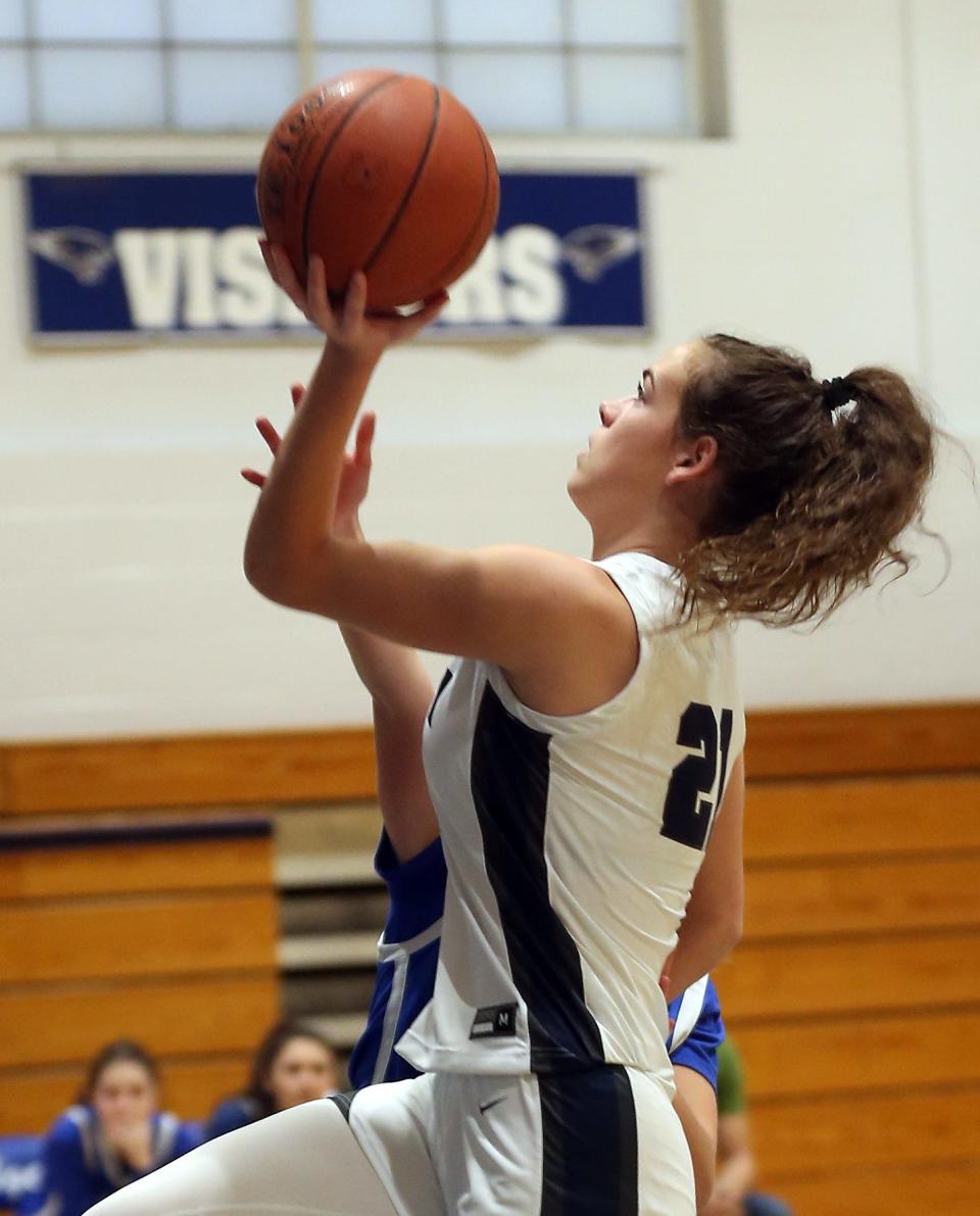 Putnam Valley's Eva DeChent (21) goes up for a shot against Haldane on her way to scoring her 2,000th point in game at Putnam Valley High School Feb. 7, 2023. 