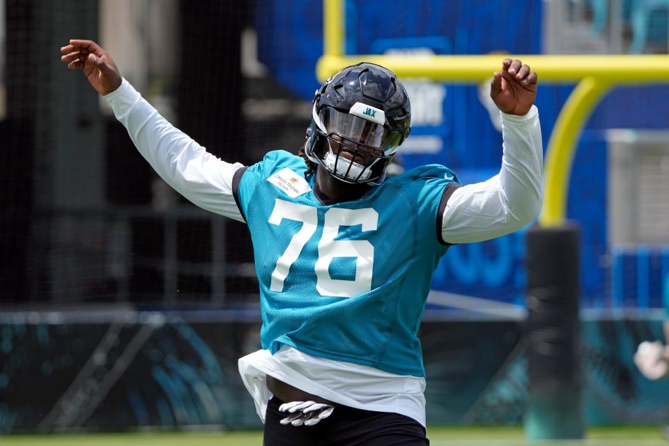 Jacksonville Jaguars offensive tackle Anton Harrison (76) warms up during an NFL football rookie camp, Friday, May 12, 2023, in Jacksonville, Fla. (AP Photo/John Raoux)