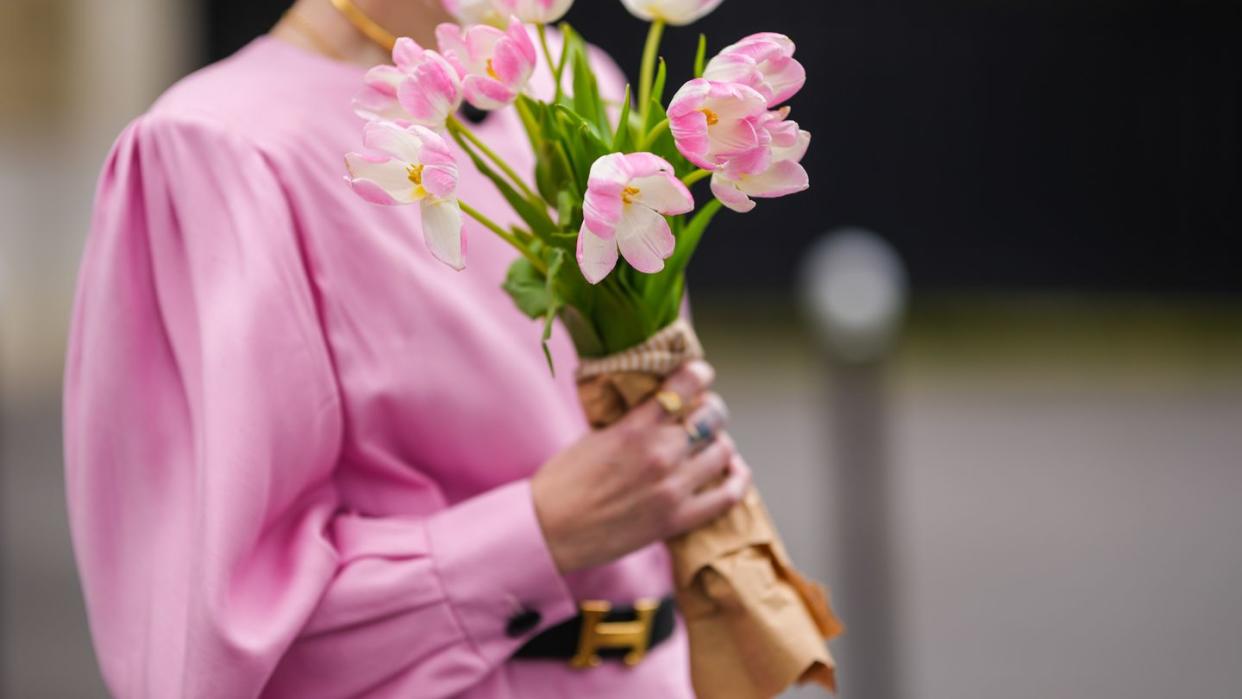 a person holding flowers