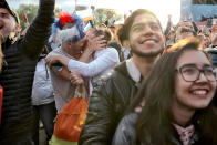 <p>A couple kiss as fans celebrate after Russia scored the first goal during the opening match of the 2018 soccer World Cup, between Russia and Saudi Arabia, in the fan zone in Yekaterinburg, Russia, Thursday, June 14, 2018. (AP Photo/Vadim Ghirda) </p>