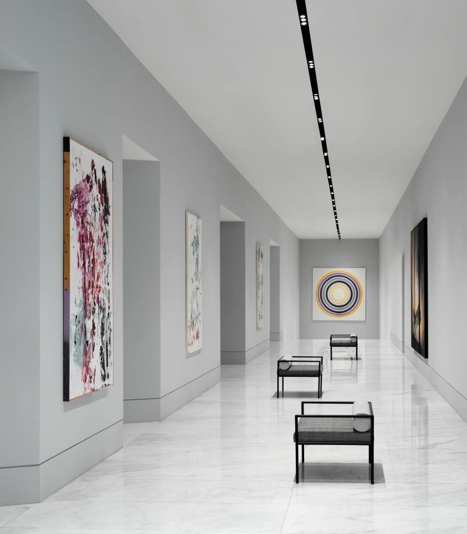 Custom-curated artworks by Creative Art Partners fill the gallery.