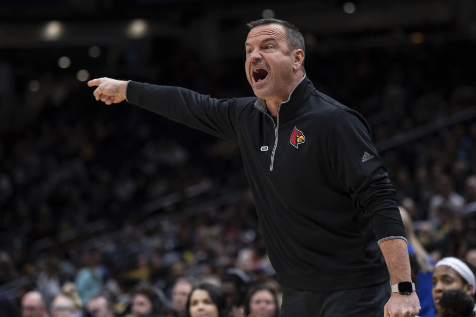 Louisville coach Jeff Walz shouts to players during the first half of the team's Sweet 16 college basketball game against Mississippi in the women's NCAA tournament Friday, March 24, 2023, in Seattle. (AP Photo/Stephen Brashear)