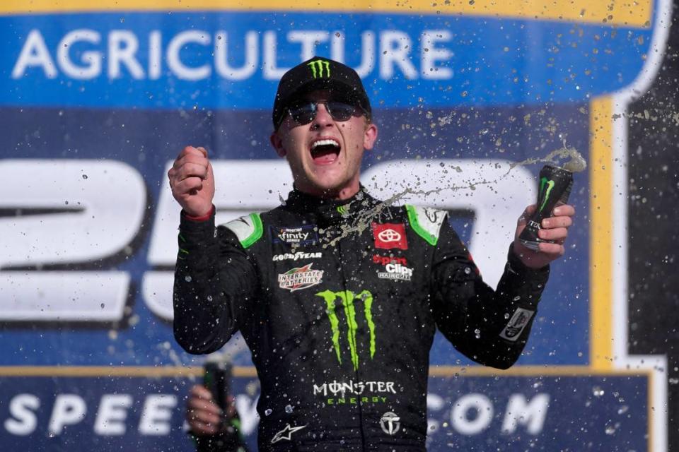 Ty Gibbs celebrates winning the New Holland 250 NASCAR Xfinity Series auto race at the Michigan International Speedway in Brooklyn, Mich., Saturday, Aug. 6, 2022. (AP Photo/Paul Sancya)