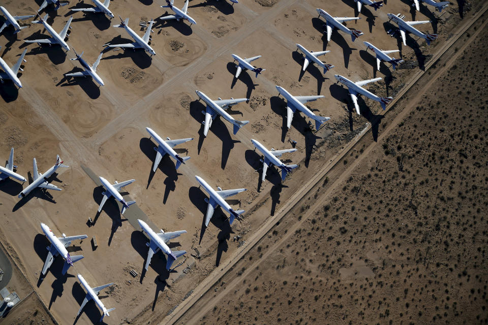 Old airplanes, including Boeing 747-400s, are stored in the desert in Victorville, California March 13, 2015. In the last year, there were zero orders placed by commercial airlines for new Boeing 747s or Airbus A380s, reflecting a fundamental shift in the industry toward smaller, twin-engine planes.<span class="copyright">Lucy Nicholson—Reuters</span>