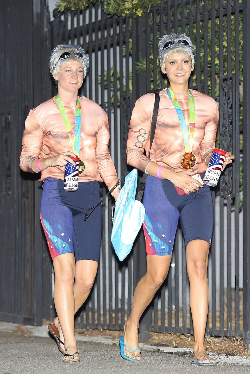 <p>Dobrev, right, had the same idea when she and a friend dressed as disgraced U.S. Olympic medalists Lochte and Jimmy Feigen. Hopefully, Taylor and Nina didn’t show up to the same party! (Photo: AKM-GSI) </p>