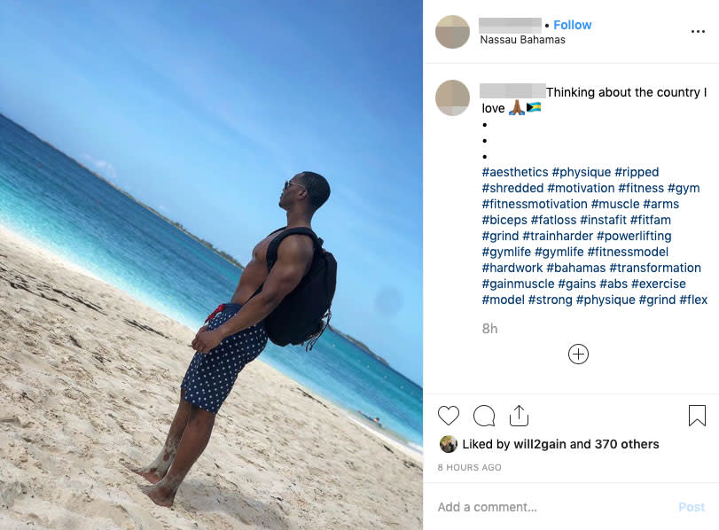 A man stands shirtless on the beach in the Bahamas and gazes out over the beach. Source: Instagram