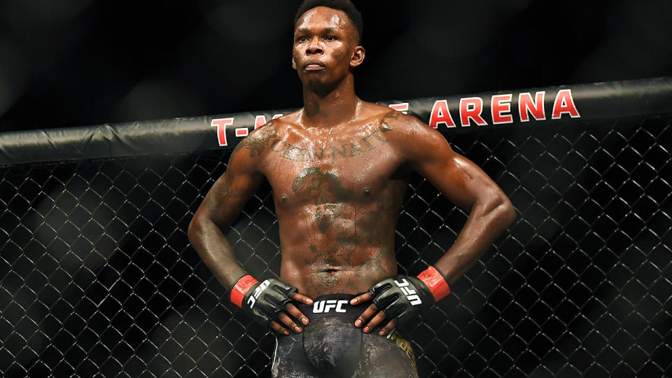 Israel Adesanya is pictured standing after a UFC bout.