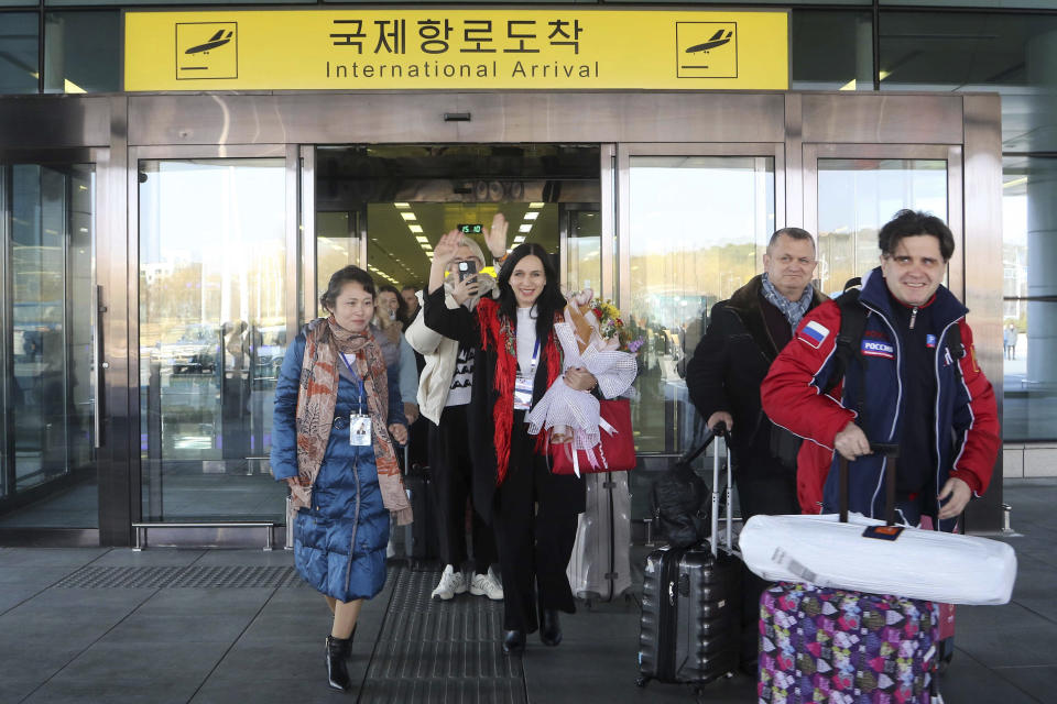 A group of Russian tourists, likely the first foreign travelers from any country to enter North Korea since the pandemic arrive at the Pyongyang International Airport in Pyongyang, North Korea, Friday, Feb. 9, 2024. (AP Photo/Cha Song Ho)