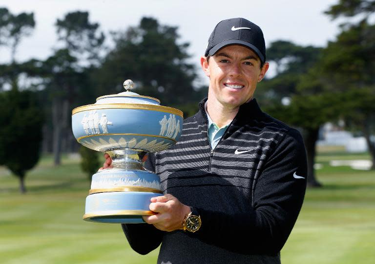 Rory McIlroy of Northern Ireland lifts the Walter Hagen Cup after defeating Gary Woodland 4&2 in the championship match of the World Golf Championships Cadillac Match Play on May 3, 2015 in San Francisco, California