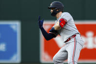 Minnesota Twins' Ryan Jeffers signals to teammates after doubling on a sharp line drive during the second inning of a baseball game against the Baltimore Orioles, Monday, April 15, 2024, in Baltimore. (AP Photo/Julia Nikhinson)