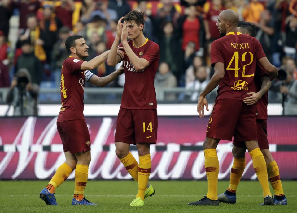 Roma forward Patrik Schick, center, celebrates after scoring celebrates after scoring his side's second goal during a Serie A soccer match between Roma and Sampdoria, at the Rome Olympic stadium, Sunday, Nov. 11, 2018. (AP Photo/Alessandra Tarantino)