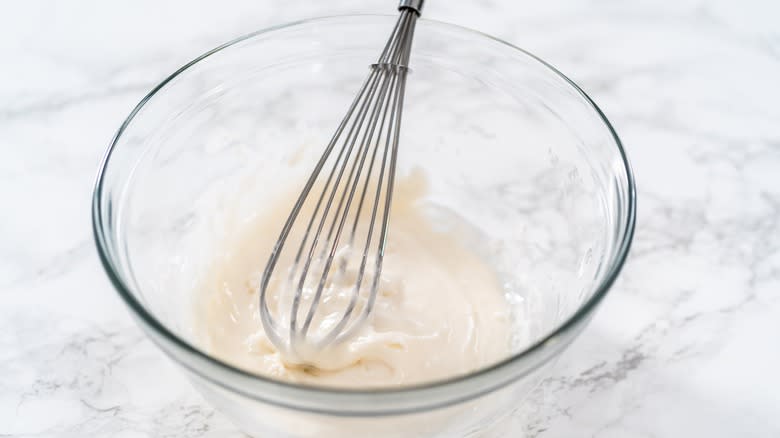 glaze and whisk in glass bowl