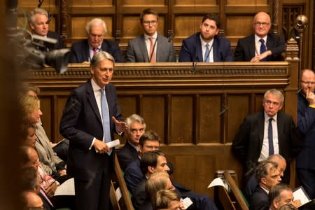 Britain's Conservative MP Philip Hammond speaks at the House of Commons in London