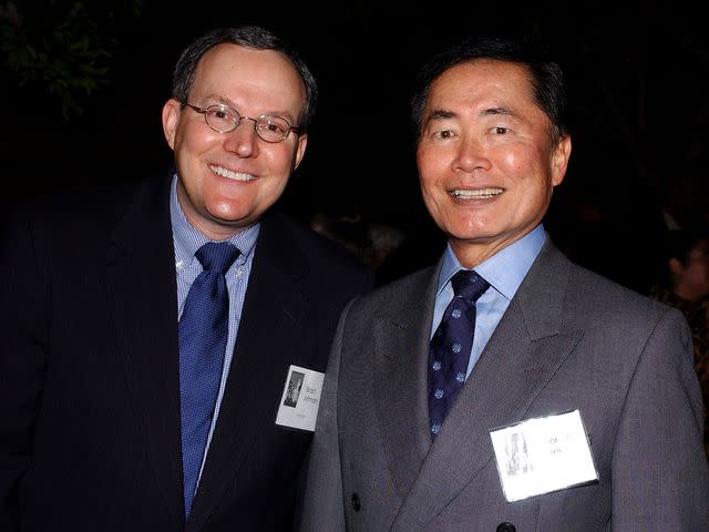 <p>Amanda Edwards/Getty</p> Brad Takei (left) and George Takei