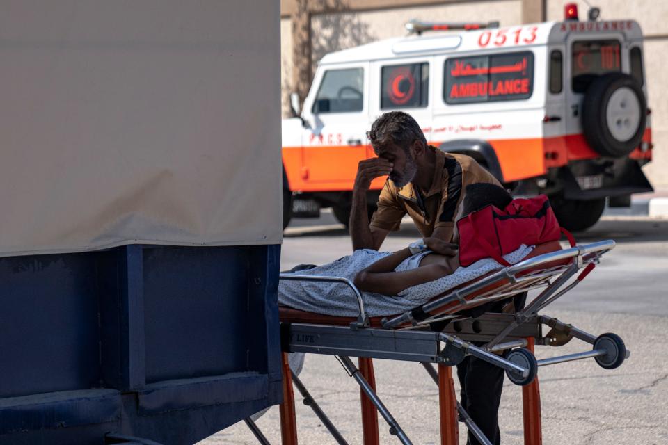 Palestinians wounded in the Israeli bombardment of the Gaza Strip are brought to the Rafah border crossing to Egypt on Nov. 1, 2023.