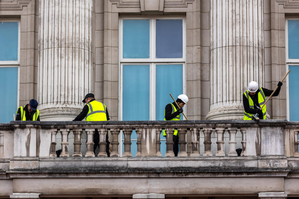 The balcony at Buckingham Palace balcony is cleaned ahead of the coronation, on April 18.<span class="copyright">Marcin Nowak—Shutterstock</span>