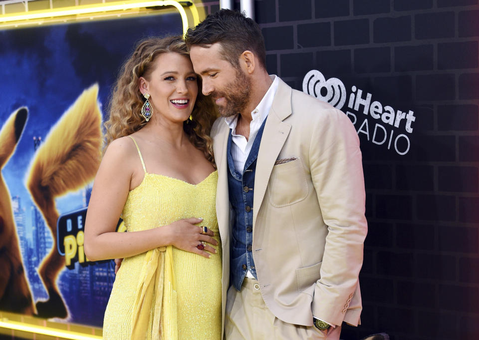 Actor Ryan Reynolds, right, is joined by his pregnant wife, actress Blake Lively at the premiere of "Pokemon Detective Pikachu" at Military Island in Times Square on Thursday, May 2, 2019, in New York. (Photo by Evan Agostini/Invision/AP)