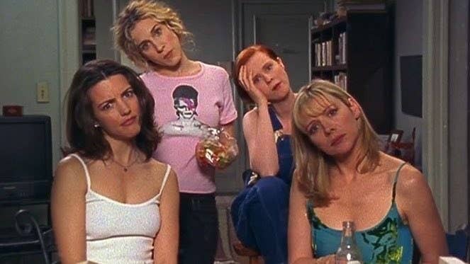 Carrie, Charlotte, Miranda, and Samantha watching a couple have sex across the street in "Sex and the City"