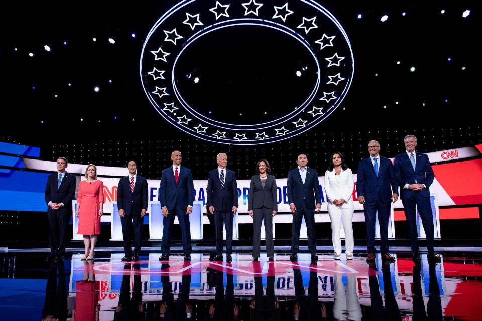 Debate stage with candidates Amy Klobuchar, Tulsi Gabbard, Cory Booker, Joe Biden, Kamala Harris, Andrew Yang, Pete Buttigieg, Elizabeth Warren, Bernie Sanders, and Tom Steyer