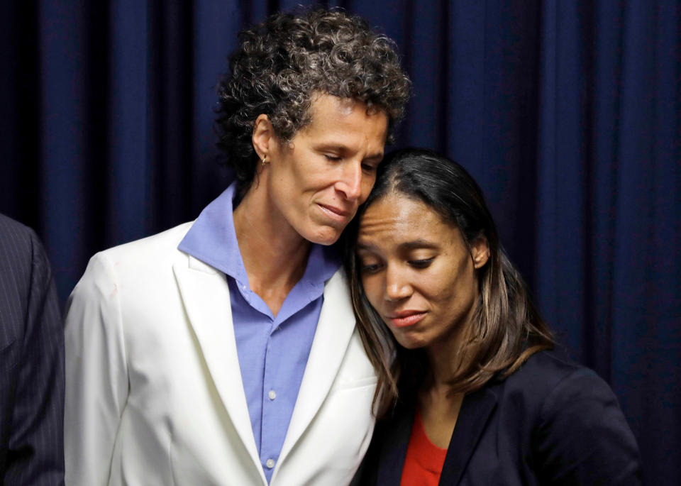 Bill Cosby accuser Andrea Constand (left) embraces prosecutor Kristen Feden during a news conference after Cosby was found guilty in his sexual assault retrial in Norristown, Pa., on April 26, 2018. Pennsylvania's highest court has overturned comedian Cosby's sex assault conviction. The court said on June 30, 2021 that they found an agreement with a previous prosecutor prevented him from being charged in the case. (AP Photo/Matt Slocum, File)