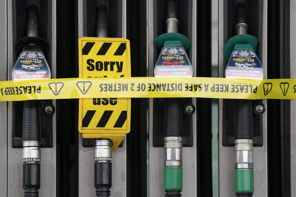 A veiw of closed pumps at a petrol station in Manchester, England, Tuesday, Sept. 28, 2021. Thousands of British gas stations have run dry, as motorists scrambled to fill up amid a supply disruption due to a shortage of truck drivers. Long lines of vehicles formed at many gas stations over the weekend, and tempers frayed as some drivers waited for hours. ( AP Photo/Jon Super)