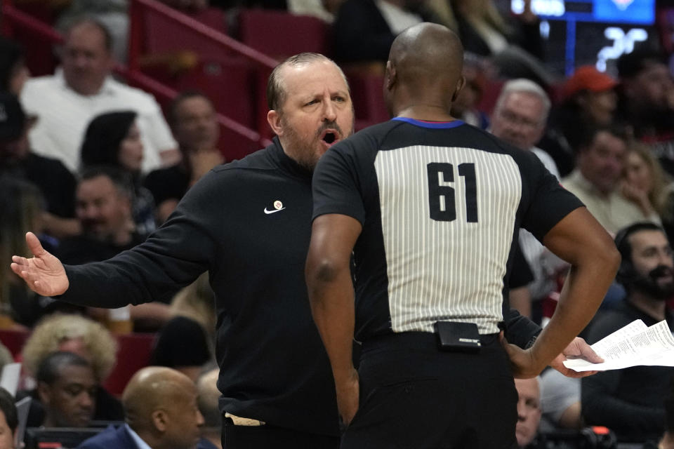 New York Knicks head coach Tom Thibodeau, left, argues a call with official Courtney Kirkland (61) during the first half of an NBA basketball game against the Miami Heat, Tuesday, April 2, 2024, in Miami. (AP Photo/Lynne Sladky)