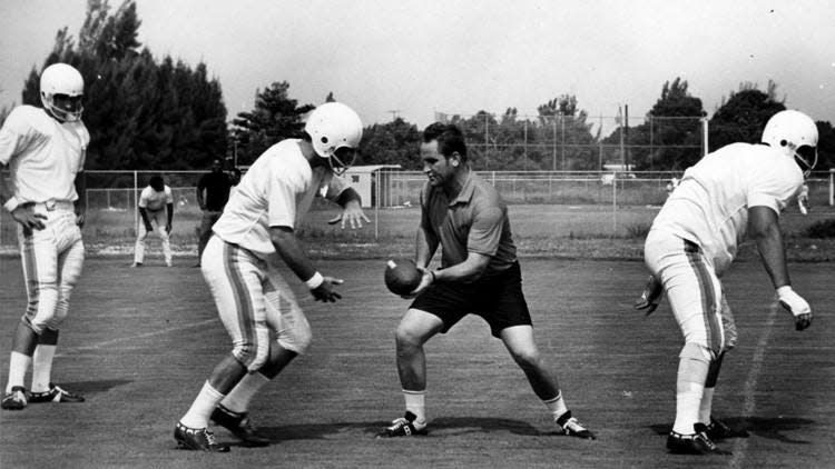 Don Shula, during his first year in Miami (1970), working on technique with fullback Larry Csonka. [AP File]