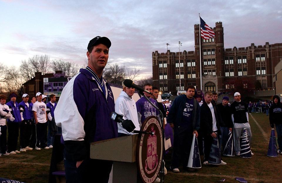 Elder head football coach Doug Ramsey speaks to the crowd at a rally to welcome the new state championship football team on Dec. 1, 2002. Ramsey and the Panthers are the only team to have played in all of the Skyline Chili Crosstown Showdowns.