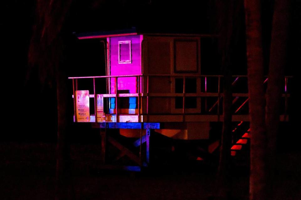 A life guard tower is illuminated by police lights after police responded to reports of multiple people shot on North Broadwalk during Memorial Day weekend at Hollywood, Florida, on Monday, May 29, 2023.