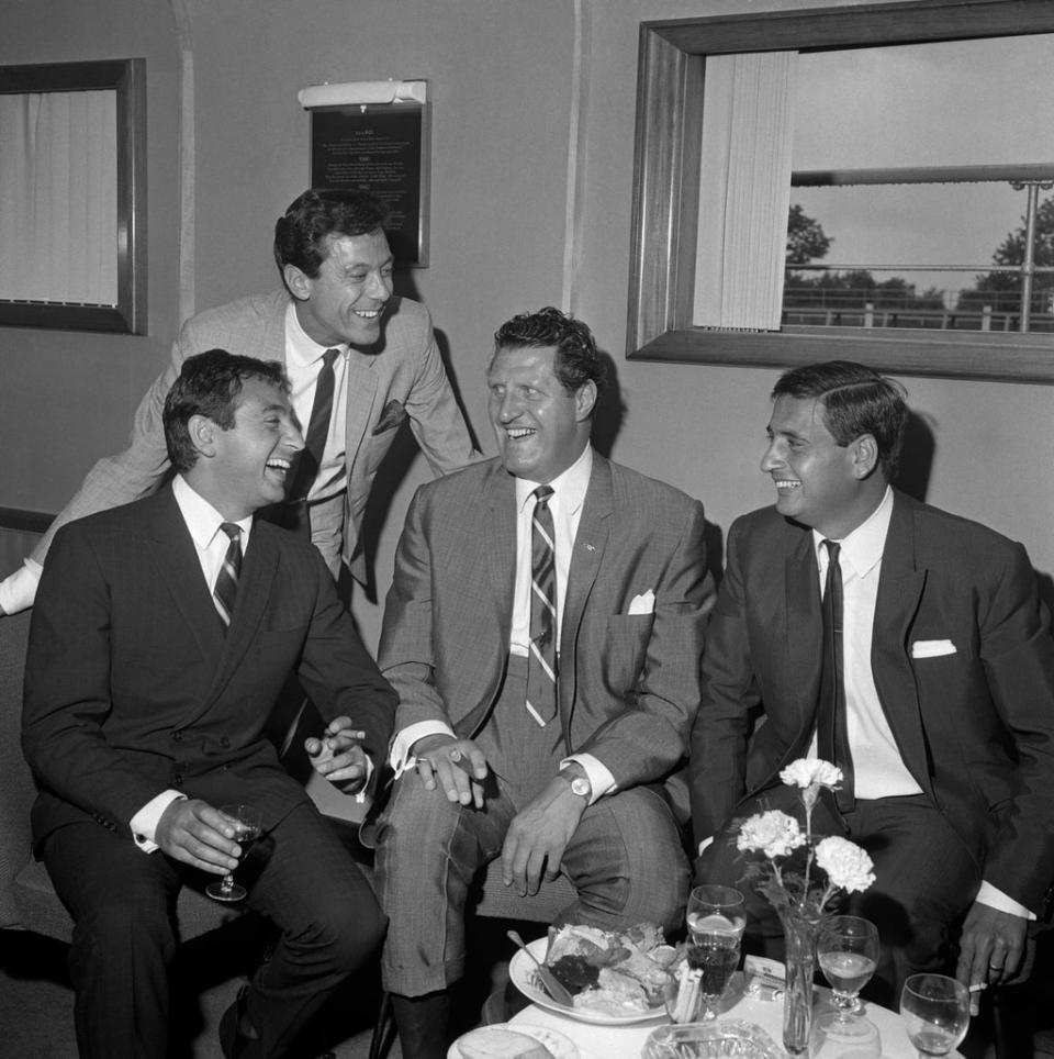 Lionel Blair (standing) appeared in Blackpool Night Out with Mike (left) and Bernie (far right) Winters, and guest star Tommy Cooper (centre) (PA Archive)