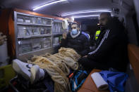 Former Palestinian prisoner Khaled Fasfous makes a victory sign in an ambulance after praying at the tomb of Palestinian leader Yasser Arafat, in the West Bank city of Ramallah, Sunday, Dec. 5, 2021. Israel released Fasfous, two weeks after striking a deal that ended his marathon 131-day hunger strike. Fasfous was the symbolic figurehead of six hunger strikers protesting Israel’s controversial policy of “administrative detention” that allows suspects to be held indefinitely without charge for months and even years (AP Photo/Majdi Mohammed)