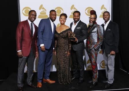 Robert Glasper Experiment Featuring Lalah Hathaway & Malcolm-Jamal Warner pose with their award for best traditional R&B performance for "Jesus Children" backstage at the 57th annual Grammy Awards in Los Angeles, California February 8, 2015. REUTERS/Mike Blake