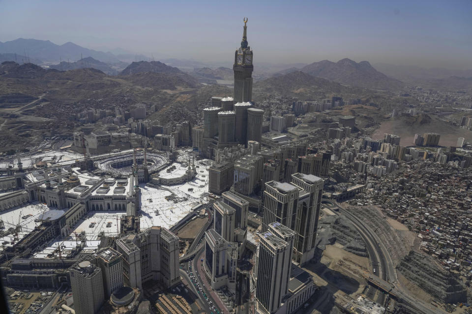 Muslim pilgrims circumambulate the Kaaba, the cubic building at the Grand Mosque, during the annual Hajj pilgrimage in Mecca, Saudi Arabia, Monday, June 17, 2024. Muslim pilgrims used the early morning hours Monday to perform the second day of the symbolic stoning of the devil, as noontime summer heat caused heatstroke among thousands wrapping up the Hajj pilgrimage (AP Photo/Rafiq Maqbool)