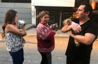 <p>People and their dogs remain on a street during a powerful earthquake in Mexico City on Feb. 16, 2018. (Photo: Pedro Pardo/AFP/Getty Images) </p>