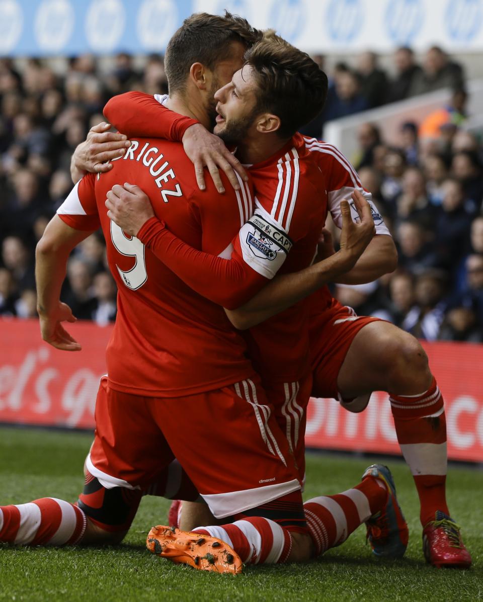 Southampton's Jay Rodriguez, left, celebrates scoring a goal with Adam Lallana during the English Premier League soccer match between Tottenham Hotspur and Southampton at White Hart Lane stadium in London, Sunday, March 23, 2014. (AP Photo/Kirsty Wigglesworth)