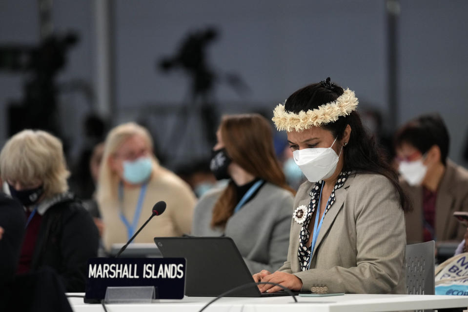 Kristina E. Stege, a delegate from the Marshall Islands works inside the hall at the COP26 U.N. Climate Summit in Glasgow, Scotland, Thursday, Nov. 11, 2021. (AP Photo/Alastair Grant)