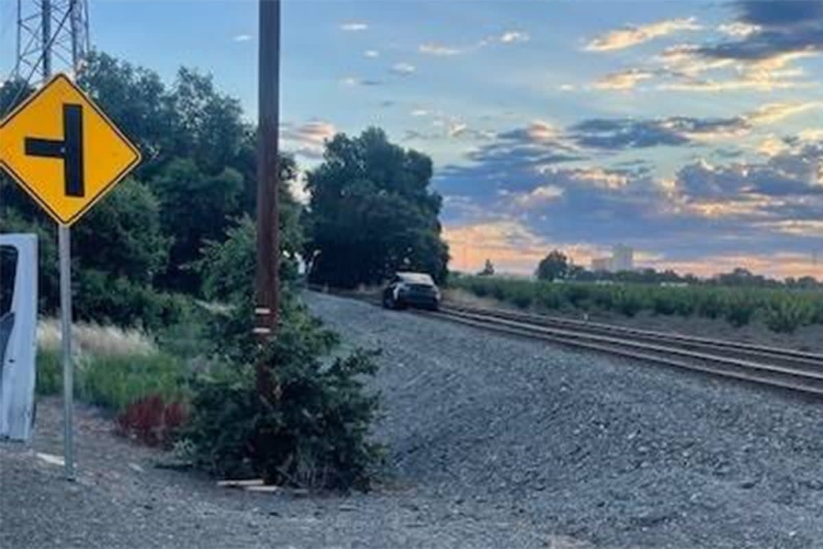 Woodland Police Department shared the image of the Tesla on the train tracks on Wednesday  (Woodland Police Department)