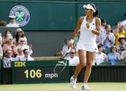 Heather Watson of Britain celebrates breaking serve during her match against Serena Williams of the U.S.A. at the Wimbledon Tennis Championships in London, July 3, 2015. REUTERS/Suzanne Plunkett