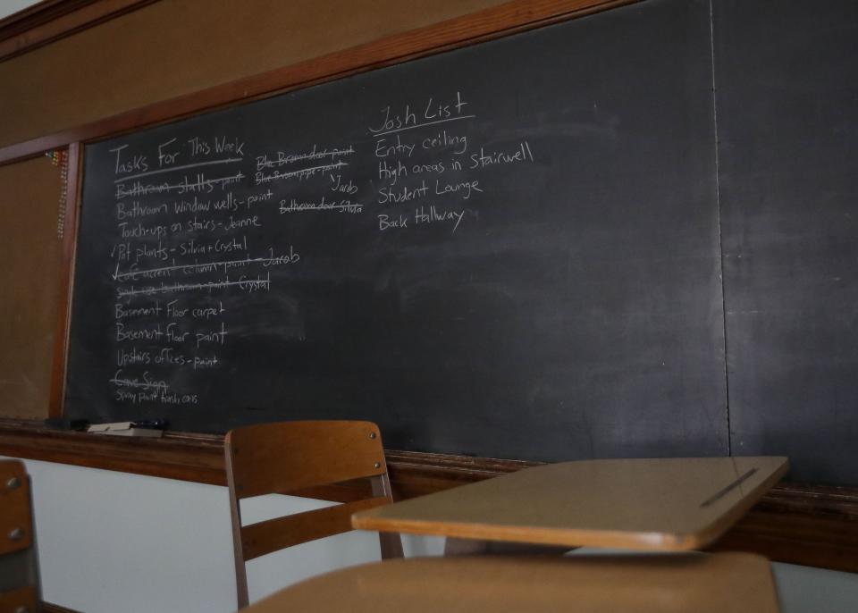 A checklist of tasks to complete is written on a chalkboard on Aug. 3 at Central Sands Community High School near Amherst Junction. The school, which is in the converted Fancher schoolhouse, will open this fall.