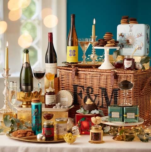 <p>The Fortnum & Mason Christmas hamper comes in at a hefty £175 – and that’s £50 below the ‘family’ version. For that, you will get two types of breakfast tea, to accompany Fortnum’s mulled cranberry and red onion marmalade on your toast. There’s two bottles of wine and a bottle of fizzy, plus champagne truffles, Cognac butter and a Christmas pudding, (Fortnum & Mason) </p>