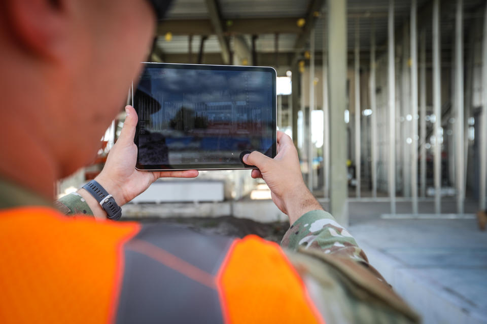 Lt. Nicholas Cap, Natural Disaster Recovery Division, USAF, shows digital twin thought augmented reality at new headquarters building. (Lucas Thompson / NBC News)